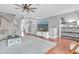 Cozy living room with neutral-colored walls, tile floor, and a flat-screen TV at 219 126Th Ave, Treasure Island, FL 33706