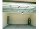 Empty garage with a utility closet at 2714 Lotus Flower Trl, Wesley Chapel, FL 33543