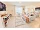 Bright living room with a view of the open floor plan and modern decor and fixtures at 2714 Lotus Flower Trl, Wesley Chapel, FL 33543