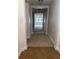 Inviting hallway with tile entry leading to a carpeted living area flooded with natural light at 2916 Shetland Ridge Dr, Valrico, FL 33596