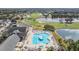 Gorgeous aerial view of the community pool, golf course, and lakes, offering a serene and picturesque setting at 29307 Schinnecock Hills Ln, San Antonio, FL 33576