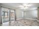 Bright bedroom with neutral paint, carpet and a large window with plantation shutters at 29307 Schinnecock Hills Ln, San Antonio, FL 33576