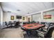 Spacious game room with multiple poker tables and chairs, designed for social gatherings and friendly competition at 29307 Schinnecock Hills Ln, San Antonio, FL 33576