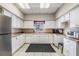 Functional kitchen with white cabinetry, modern appliances, and ample counter space for meal preparation at 29307 Schinnecock Hills Ln, San Antonio, FL 33576