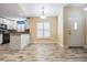 Bright eat-in kitchen featuring granite countertops, white cabinets, and tile floors at 29307 Schinnecock Hills Ln, San Antonio, FL 33576