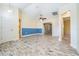 Living area with tile flooring, fresh two-tone paint, and a bright open floorplan at 29307 Schinnecock Hills Ln, San Antonio, FL 33576