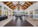 Inviting lobby area with vaulted ceilings, rustic beams, and comfortable seating at 29307 Schinnecock Hills Ln, San Antonio, FL 33576