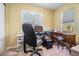 Bright home office with a desk, office chair, and natural light from the window at 29307 Schinnecock Hills Ln, San Antonio, FL 33576