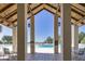 Relaxing view of the community pool from a covered pavilion, showcasing its amenities at 29307 Schinnecock Hills Ln, San Antonio, FL 33576