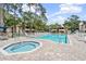 Inviting community pool and jacuzzi area, perfect for relaxation with abundant lounge seating at 2983 Bonaventure Cir # 204, Palm Harbor, FL 34684