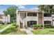 Inviting condo building with a two-story design, lush landscaping, and visible unit numbers at 2983 Bonaventure Cir # 204, Palm Harbor, FL 34684