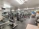 Well-equipped fitness center with mirrored walls, providing a spacious area for residents' workouts at 2983 Bonaventure Cir # 204, Palm Harbor, FL 34684