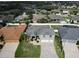 Aerial view of home featuring a well-manicured lawn and mature landscaping at 3822 Salida Delsol Dr, Sun City Center, FL 33573