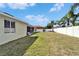 Spacious backyard featuring lush green grass and a white privacy fence at 3822 Salida Delsol Dr, Sun City Center, FL 33573