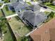 Aerial view of backyard with white vinyl fence, screened-in patio, and well-maintained lawn at 3822 Salida Delsol Dr, Sun City Center, FL 33573