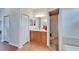 Well-lit bathroom with vanity, tile flooring, and glass shower enclosure at 3822 Salida Delsol Dr, Sun City Center, FL 33573