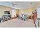 Bright bedroom with a ceiling fan, a window with blinds, and a decorative bedspread at 3822 Salida Delsol Dr, Sun City Center, FL 33573