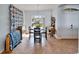 Bright dining room with tile floors, arched window, and elegant chandelier at 3822 Salida Delsol Dr, Sun City Center, FL 33573