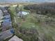 Aerial view of the community golf course with pond and lush landscaping at 3822 Salida Delsol Dr, Sun City Center, FL 33573