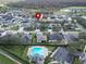 Aerial view of the neighborhood, community pool and location pin at 3822 Salida Delsol Dr, Sun City Center, FL 33573