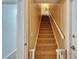 Carpeted stairway with a white handrail and baby gate on the first step at 3822 Salida Delsol Dr, Sun City Center, FL 33573