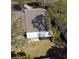 Aerial view of the property highlighting the backyard and screened lanai at 3942 La Costa Ln, Largo, FL 33771