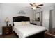 Well-lit bedroom features a dark wood bed frame and matching nightstands at 3942 La Costa Ln, Largo, FL 33771