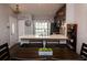 Stylish dining area adjacent to the kitchen, featuring an island and view of the kitchen at 3942 La Costa Ln, Largo, FL 33771