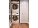 Convenient laundry area with a stackable Samsung washer and dryer setup and closet at 3942 La Costa Ln, Largo, FL 33771