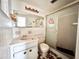 Vintage bathroom with tiled shower, vanity, and patterned tile floor at 4233 Abaco Ct, New Port Richey, FL 34653