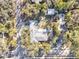 Aerial view of a home featuring a large lot, mature trees, and a private backyard at 472 Pine St, Tarpon Springs, FL 34689