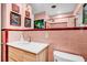 Bathroom featuring pink tile and a new sink at 472 Pine St, Tarpon Springs, FL 34689