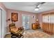 Comfortable bedroom featuring a chair and screened porch access at 472 Pine St, Tarpon Springs, FL 34689