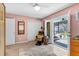 Bedroom featuring a closet, a chair and screened porch access at 472 Pine St, Tarpon Springs, FL 34689