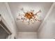 Unique starburst chandelier adds a modern touch to the home's entryway and provides ample lighting at 472 Pine St, Tarpon Springs, FL 34689