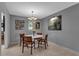 Light and airy dining room featuring a modern light fixture and bright decor at 472 Pine St, Tarpon Springs, FL 34689