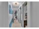 Bright hallway featuring terrazzo floors, fresh paint and ample storage space at 472 Pine St, Tarpon Springs, FL 34689