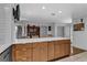 Kitchen island with modern countertops, ample storage, and barstool seating at 472 Pine St, Tarpon Springs, FL 34689