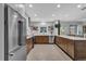 Stylish kitchen featuring stainless steel appliances, tile backsplash, and sleek countertops at 472 Pine St, Tarpon Springs, FL 34689