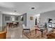 Open living area featuring terrazzo flooring with dining area and comfortable seating at 472 Pine St, Tarpon Springs, FL 34689