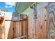 Close up of the outdoor shower showcasing its rustic design and the privacy provided by the wooden enclosure at 472 Pine St, Tarpon Springs, FL 34689