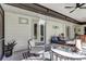 Cozy screened porch with seating and plants at 472 Pine St, Tarpon Springs, FL 34689