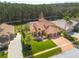 Beautiful aerial view of the property showing the home's layout, landscaping, and water views at 4873 Quill Ct, Palm Harbor, FL 34685