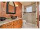 Elegant bathroom featuring a vessel sink, granite countertops, and a glass-enclosed shower at 4873 Quill Ct, Palm Harbor, FL 34685