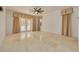 Bedroom with double doors leading to a balcony and ceiling fan at 4873 Quill Ct, Palm Harbor, FL 34685