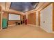 Spacious home theater room with projector and screen, perfect for movie nights and entertainment at 4873 Quill Ct, Palm Harbor, FL 34685