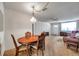 Dining room with wood table, chandelier, and seamless access to the adjacent living area at 5925 Shore S Blvd # 406, Gulfport, FL 33707