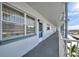 Hallway view of the condo's exterior showcasing the walkway and outside entrance at 5925 Shore S Blvd # 406, Gulfport, FL 33707