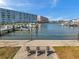 Waterfront view of a canal with dock and boats, including a bench at 5925 Shore S Blvd # 406, Gulfport, FL 33707