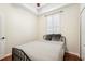 Bedroom with wood floor, ceiling fan and shutters on the window at 6040 Fishhawk Crossing Blvd # 6040, Lithia, FL 33547